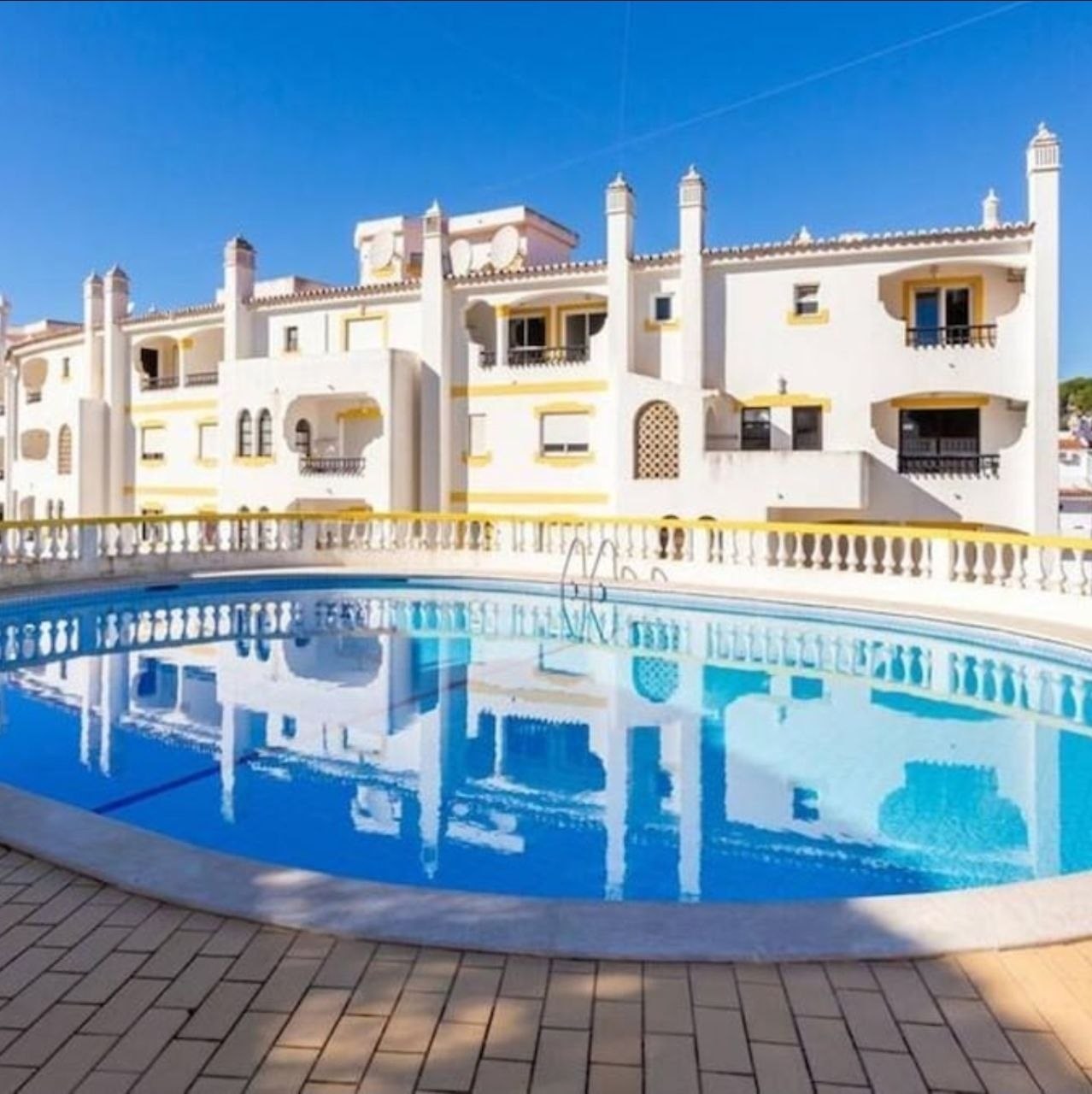 LovelyStay apartment building and pool