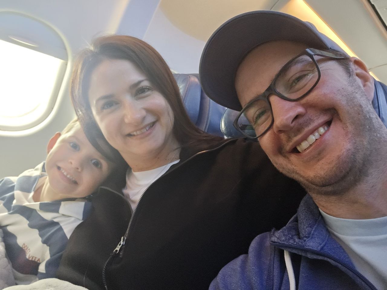 Family selfie on the plane departing Montreal for Lisbon