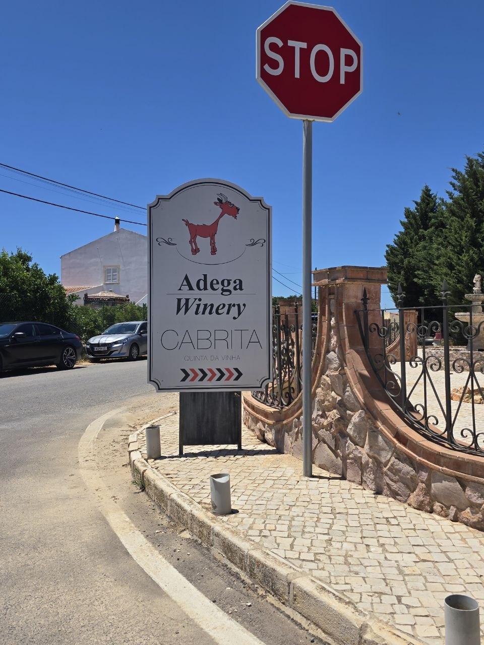 Adega Winery Cabrita sign beside a stop sign near Lagoa