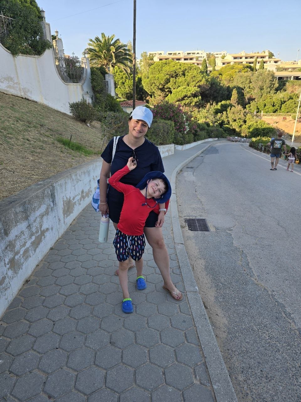 Catherine and Noah walking back to the car from Praia de Nossa Senhora da Rocha