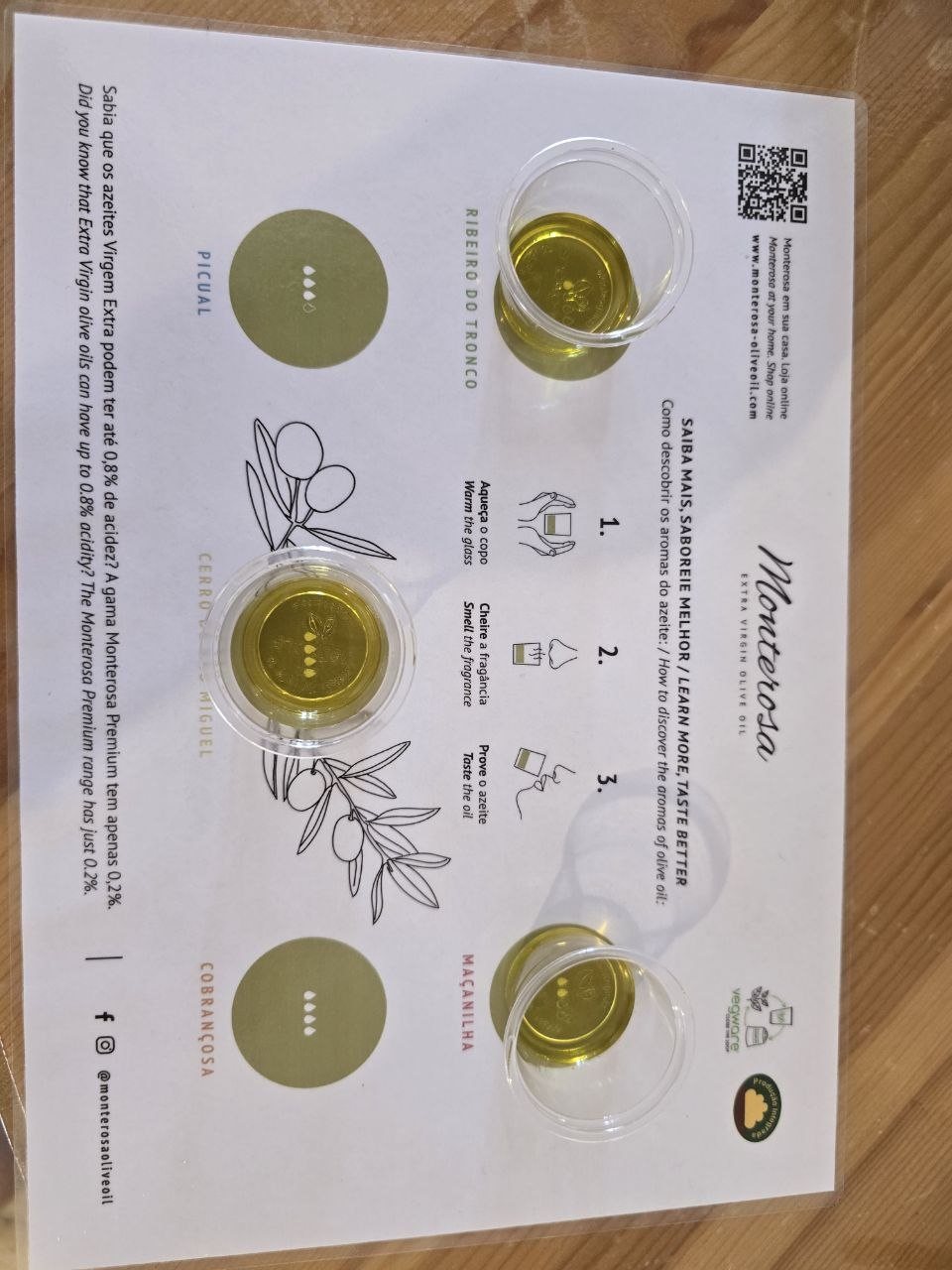 Monterosa olive oil tasting mat with three small cups of golden olive oil