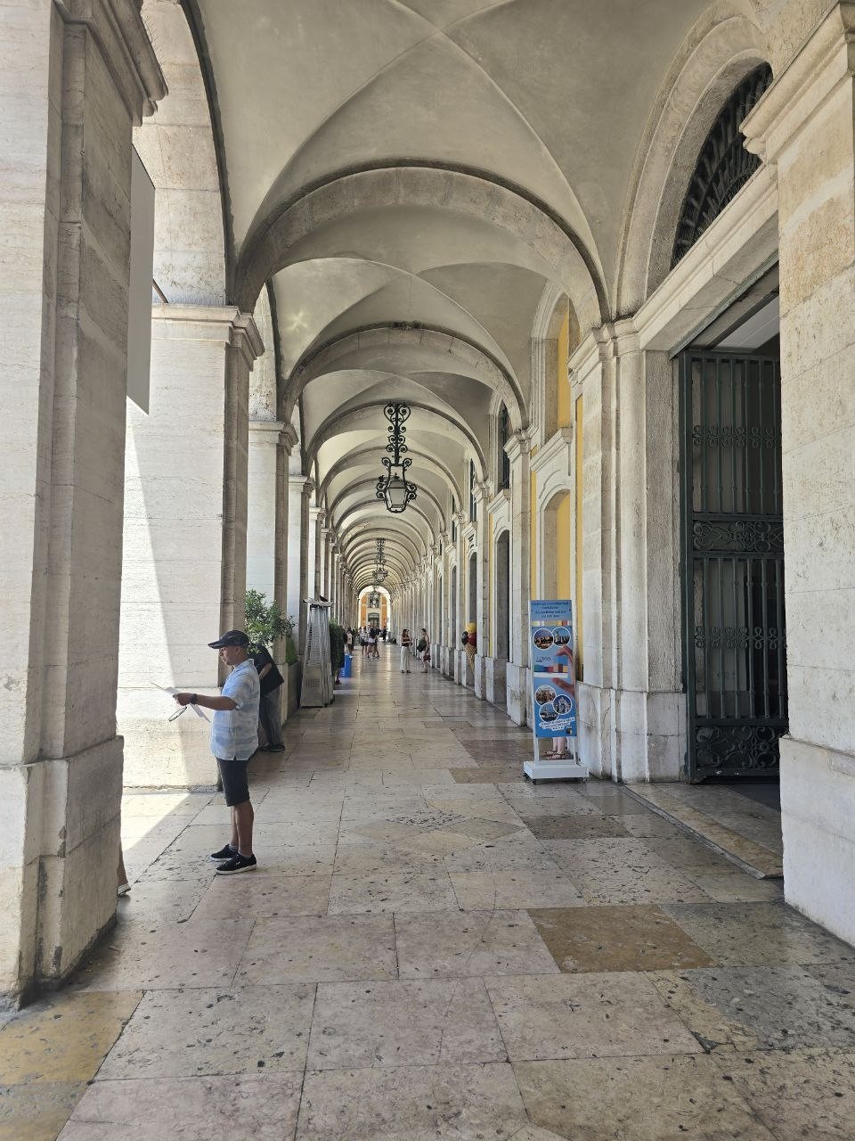 Long vaulted arcades at Praça do Comércio in Lisbon