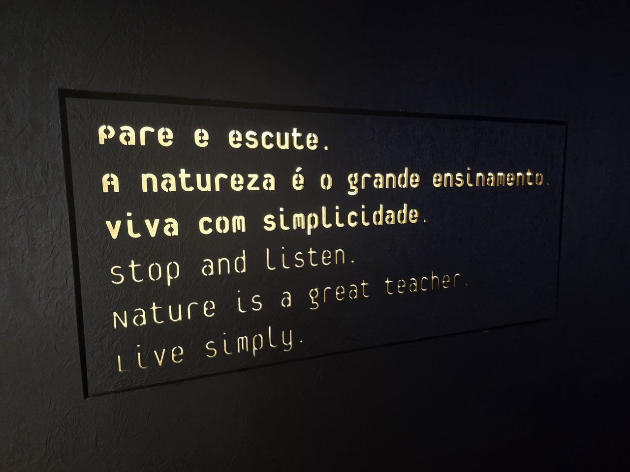 Aquarium sign reading stop and listen nature is a great teacher