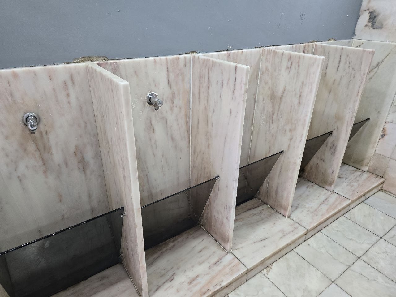 Marble urinals in the Pestana Cascais bathroom