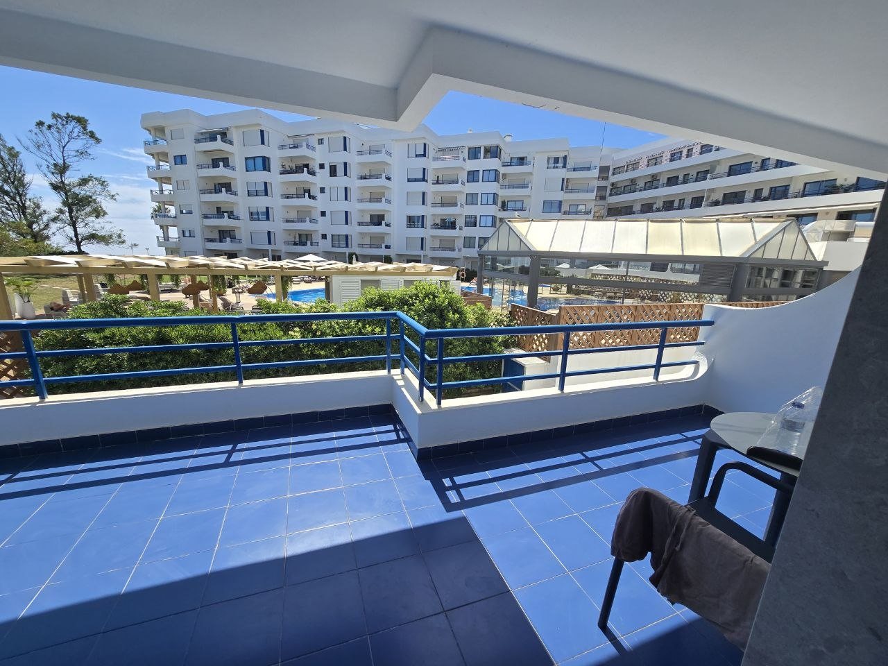 Balcony view over Pestana Cascais pool and hotel buildings