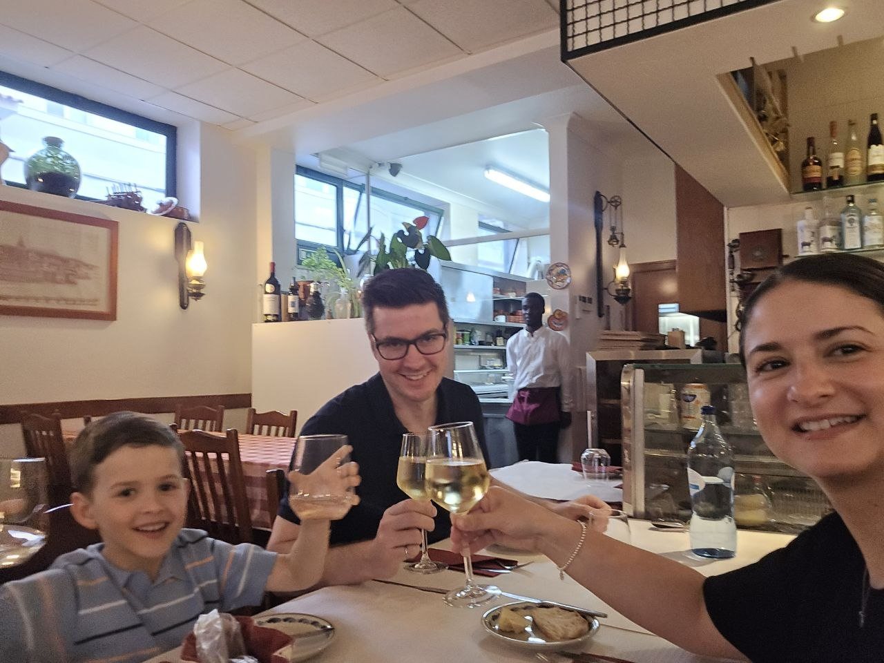 Family toasting at Restaurant Pereira in Cascais