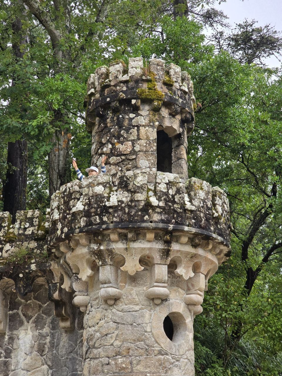 Close-up of an ornate stone tower at Quinta da Regaleira