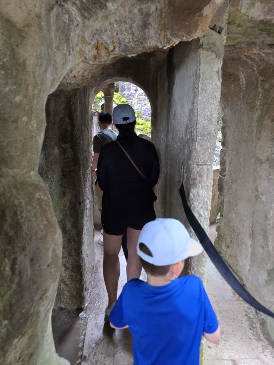 Noah entering a narrow stone passageway