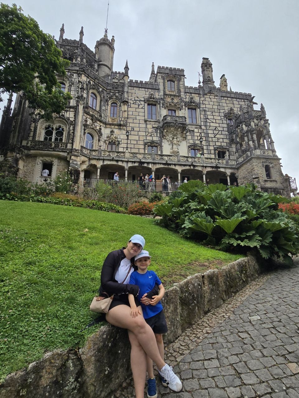 Dad and Noah sitting in front of Quinta da Regaleira