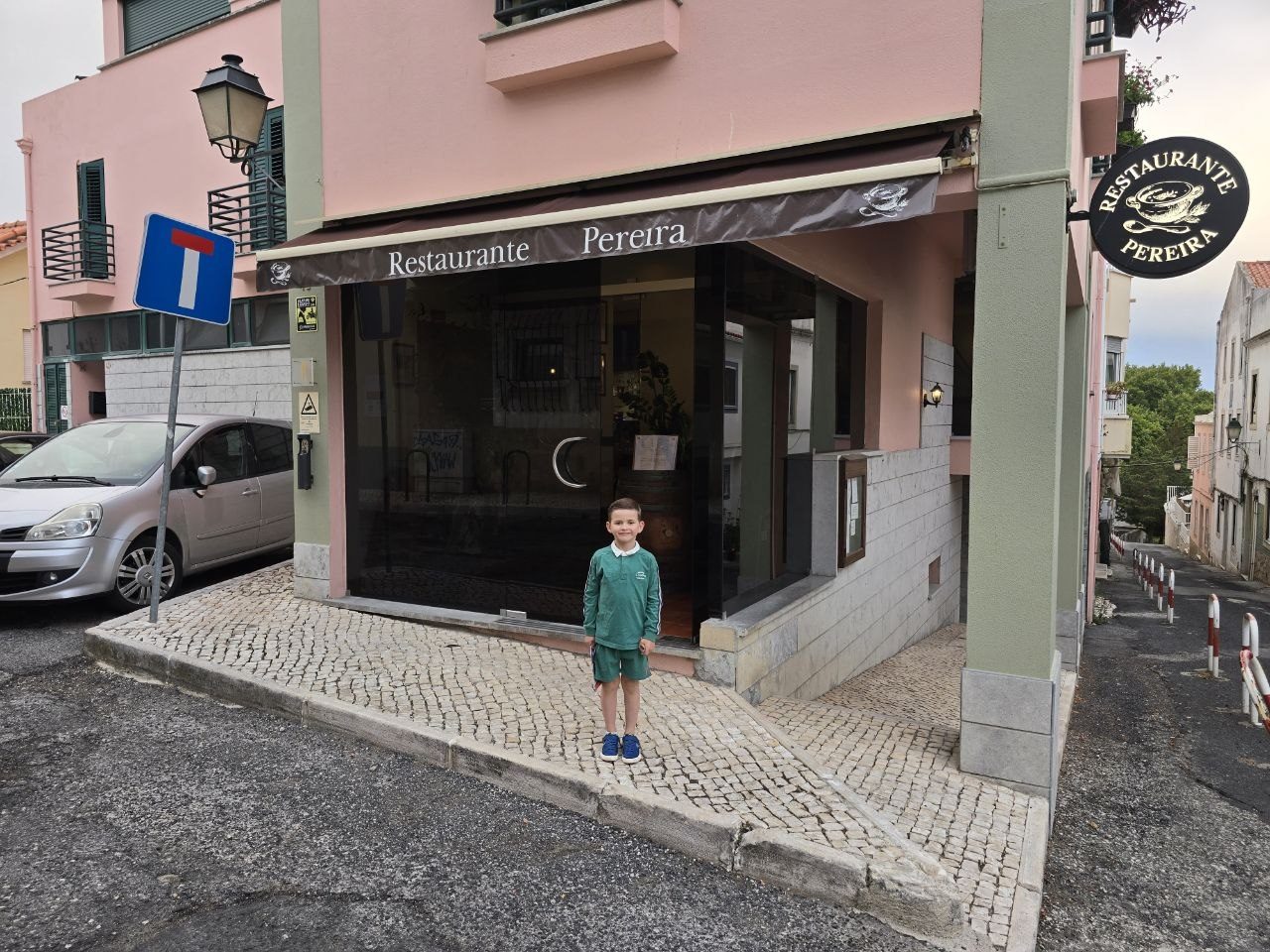 Noah standing outside Restaurant Pereira in Cascais