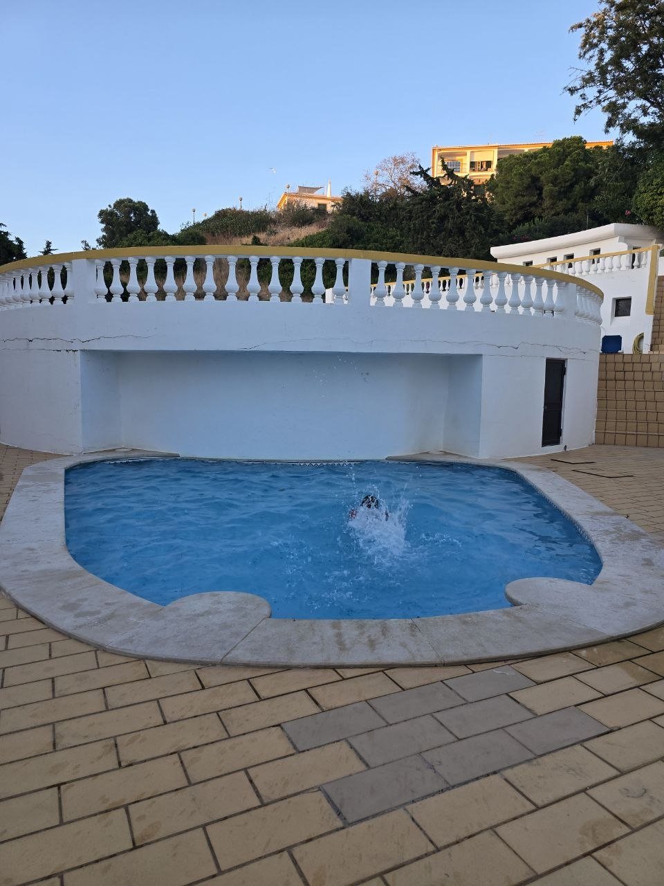 Noah splashing into the Carvoeiro condo pool