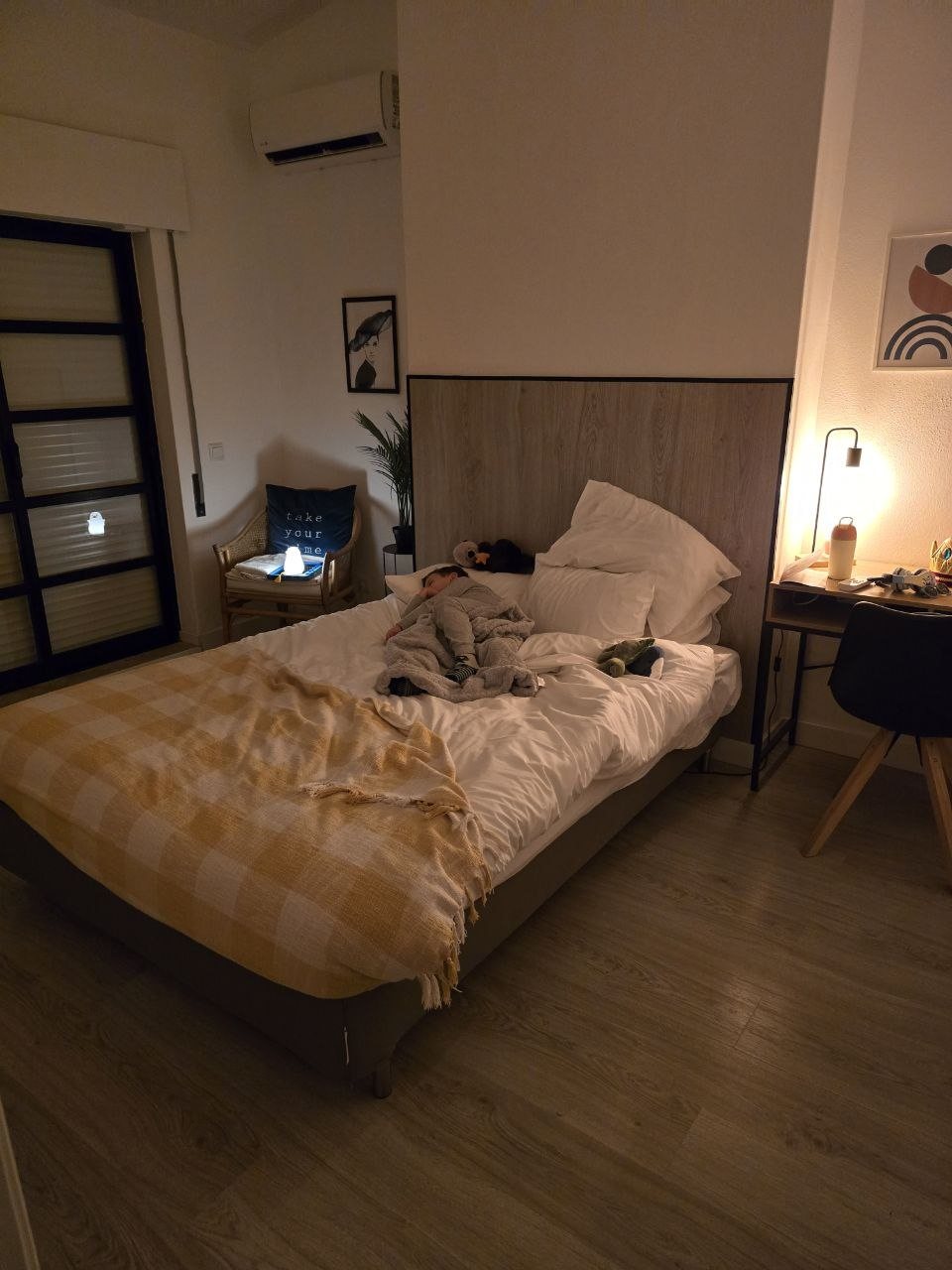 Cozy bedroom at the Carvoeiro condo with Noah asleep on the bed