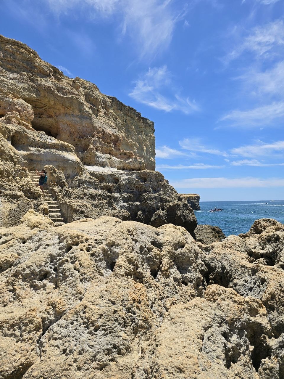 Rugged limestone path at Algar Seco with ocean beyond