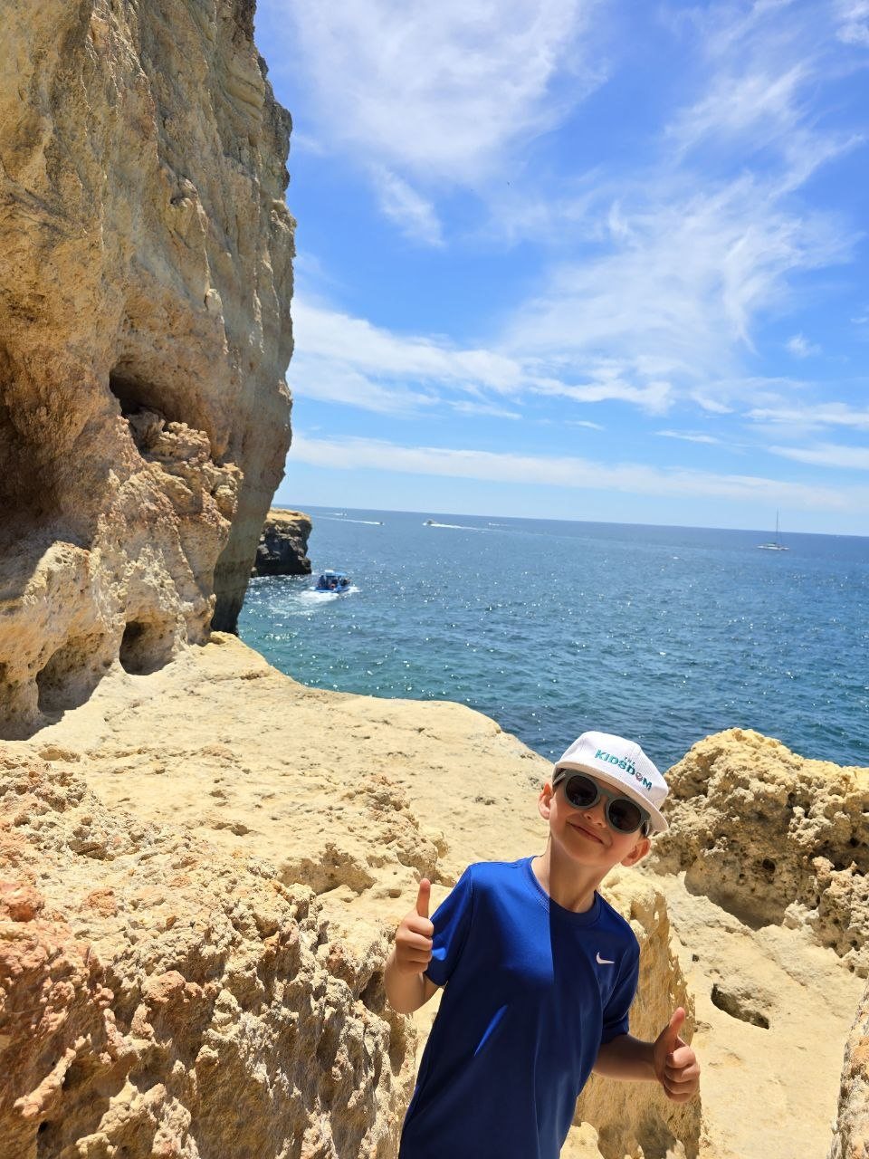 Noah standing on pale limestone rocks at Algar Seco