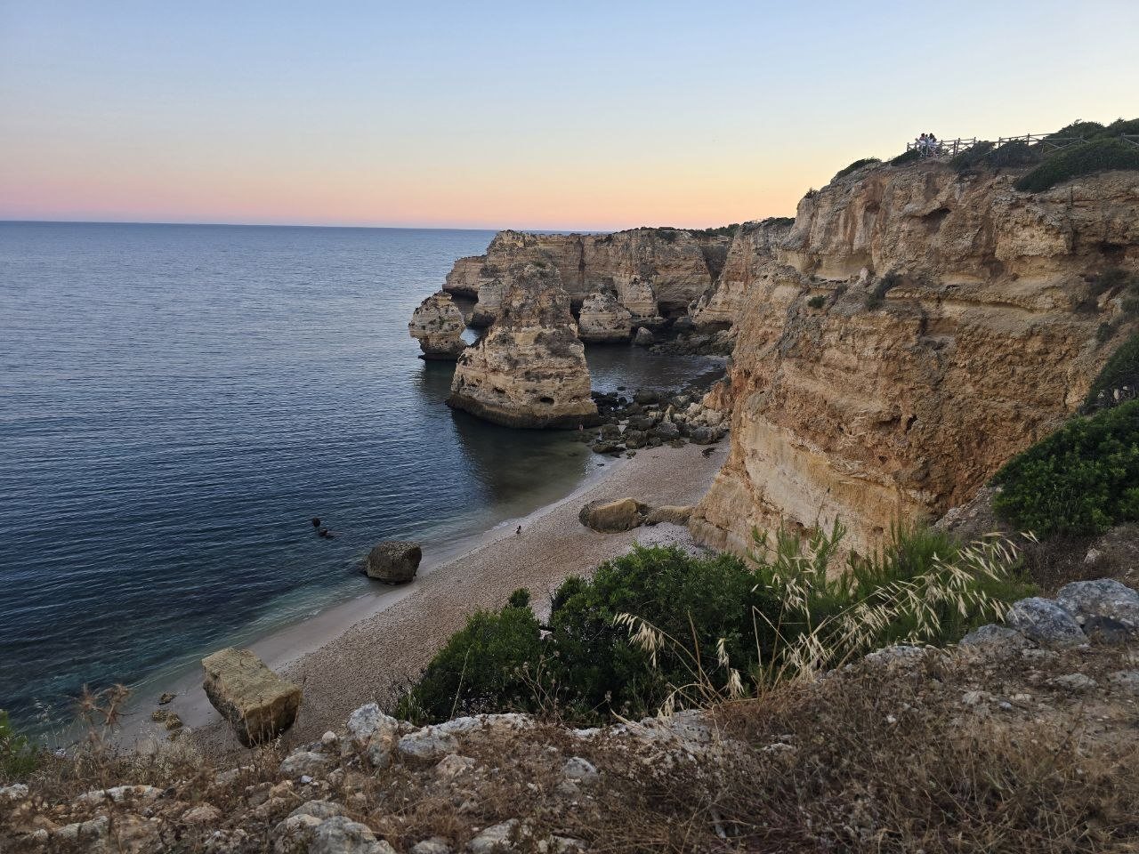 Praia da Marinha cliffs, sea stacks and beach at sunset