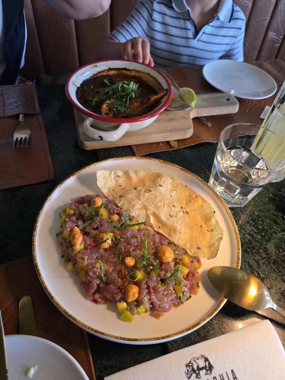 Colorful first dinner plates on the table at Geographia