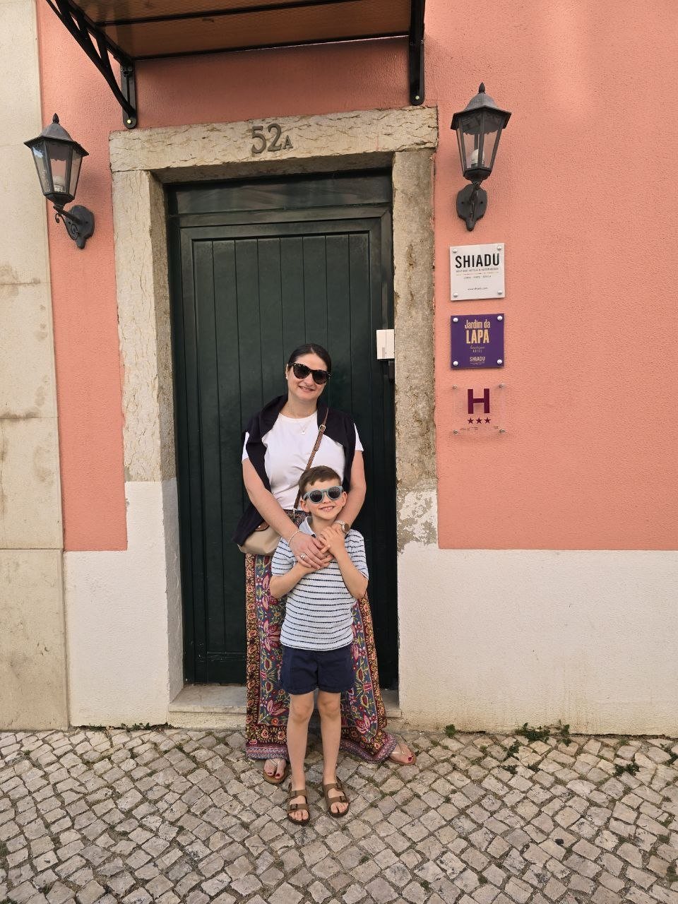 Catherine and Noah standing at the Jardim da Lapa entrance door